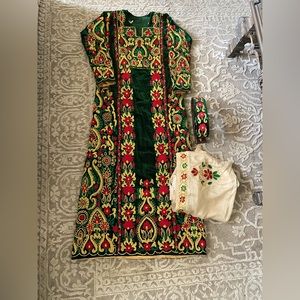 Hand made machine embroidered Palestinian thobes